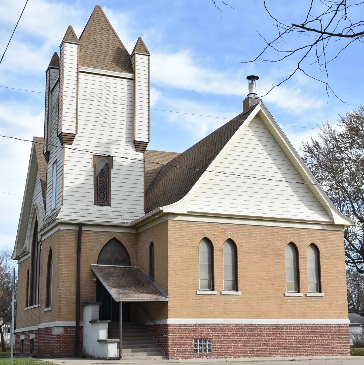 Mitchellville First Congregational Church: the brick church with its white bell tower and arched windows